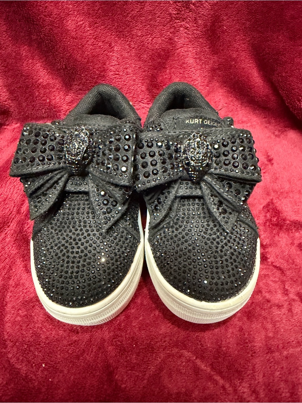 These are the Kurt Geiger London Mini Laney Bow sneakers